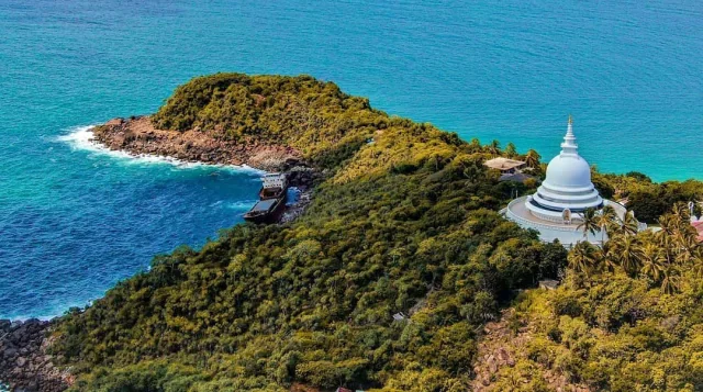 Aerial view of the Japanese Peace Pagoda at Rumassala overlooking the coastline