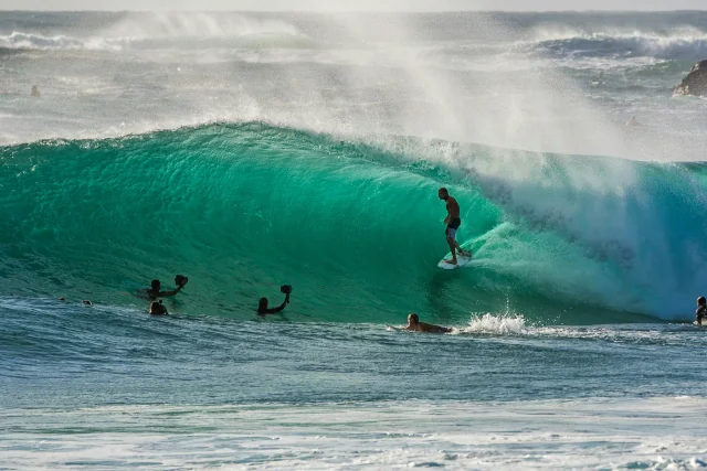 Surfer riding a wave at Surf Point, Ahangama, near Tèya Beach Hotel